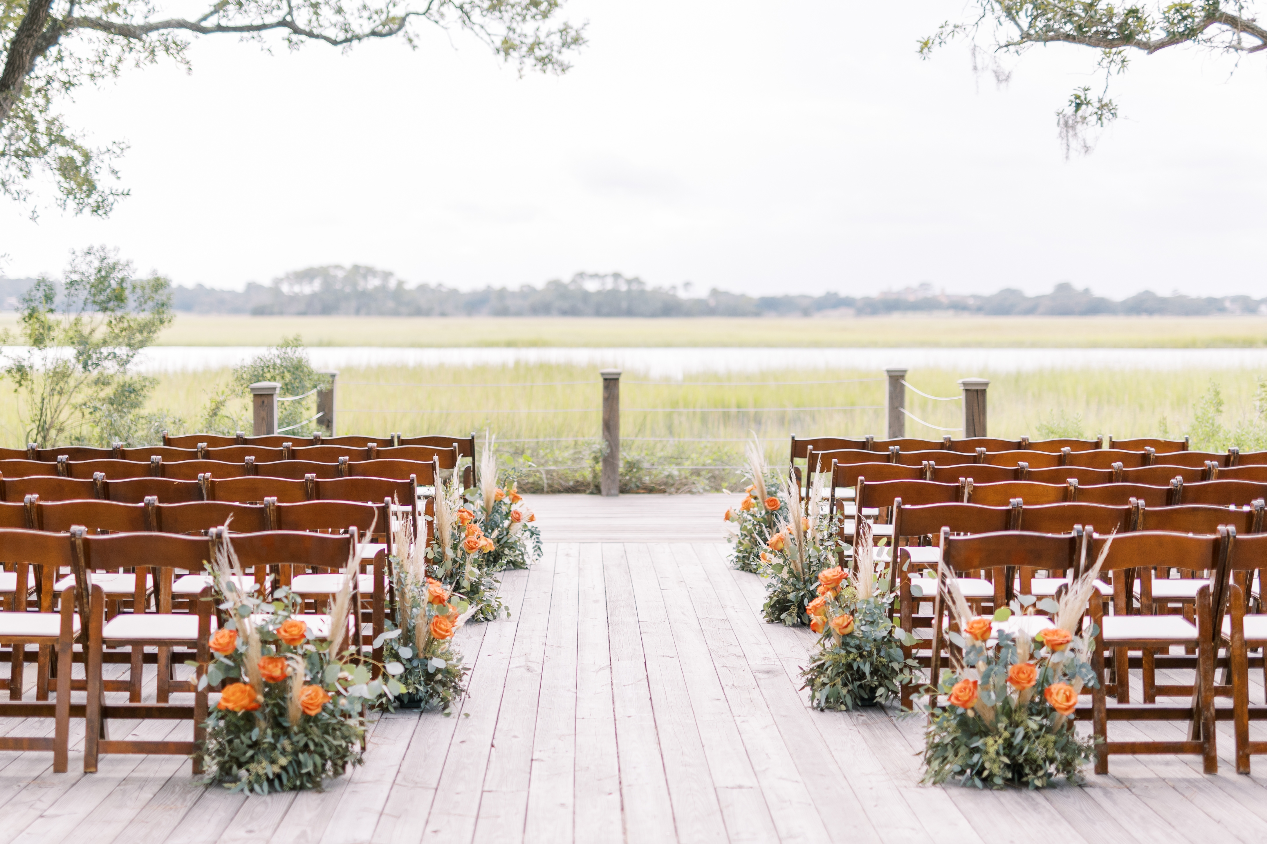 Mingo Point venue with ceremony chairs under live oaks